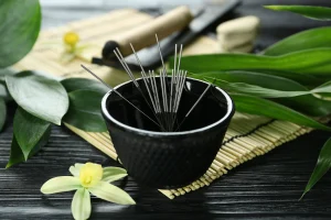 acupuncture needles in a bowl