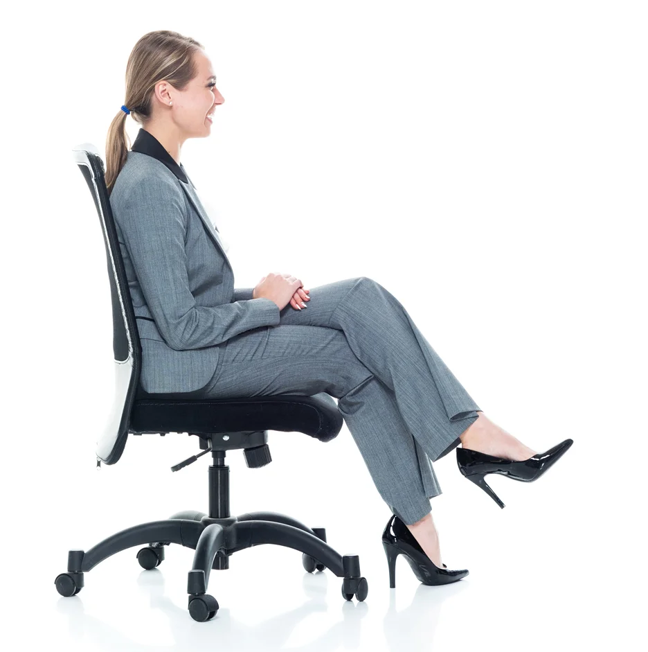 office girl sits on a chair while crossing her legs