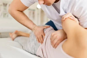 chiropractor performs manipulation on the patient