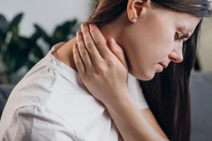 woman suffers neck pain