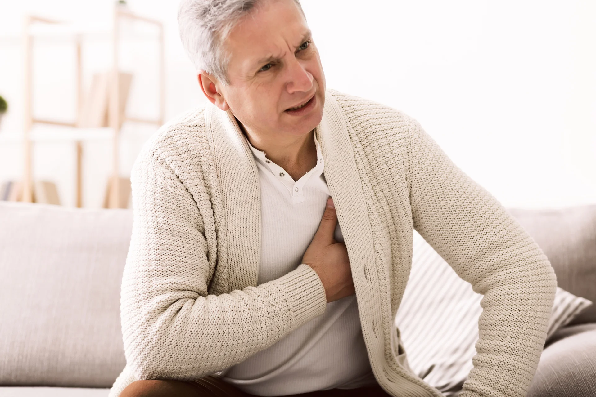 senior man suffering chest pain