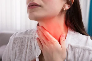 woman suffers front neck pain