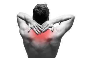 a man suffering from upper back pain