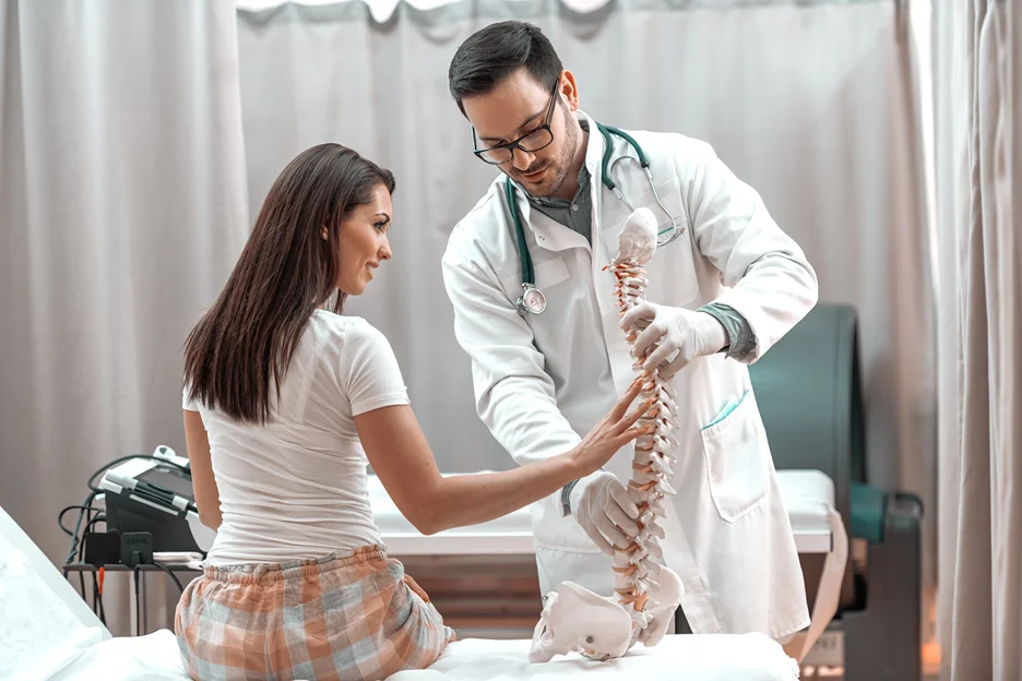 doctor explains spine anatomy to his patient