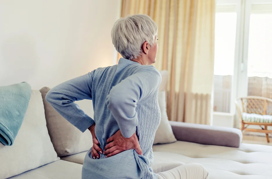 mature woman with lower back pain problem