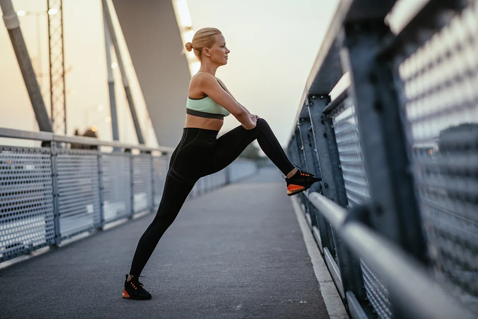 a woman stretching outdoor