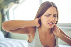 woman suffering from neck pain