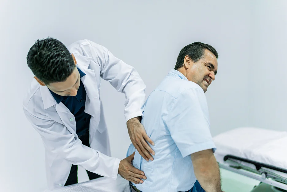 doctor and patient consultation on sciatica pain