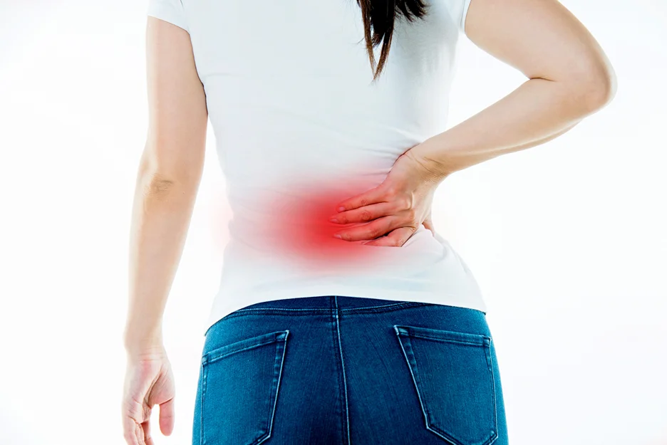 a woman suffers from sciatica pain