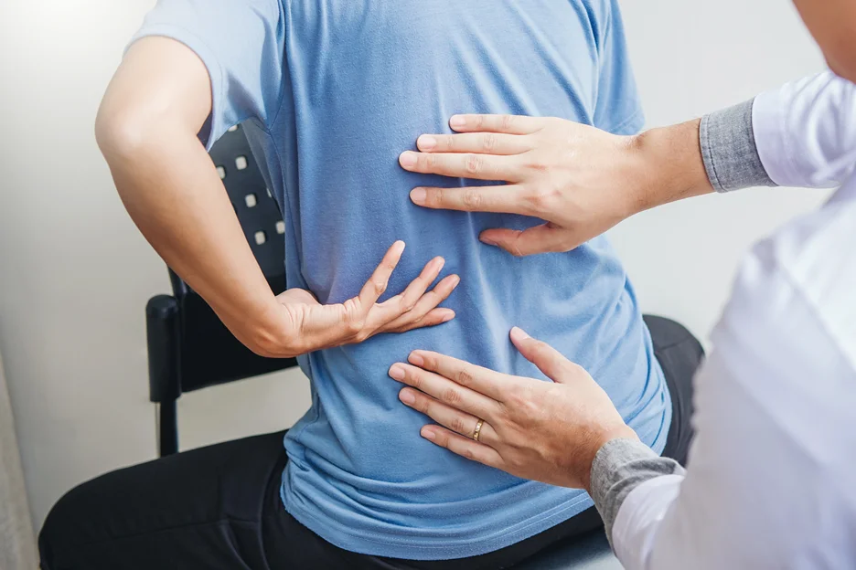 doctor and patient consult on degenerative disc disease and sciatica