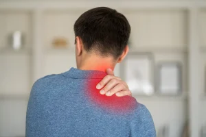a man suffers from upper back pain