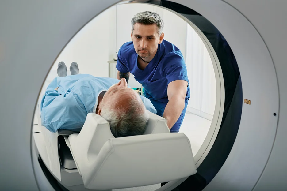 a matured man undergoes ct scan test for neck pain diagnosis