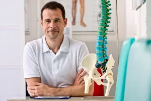 chiropractor sitting inside his office