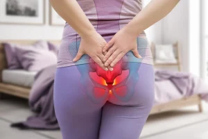 a woman suffers from sciatica tailbone pain