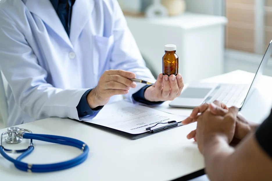 a doctor gives prednisone prescription to the patient for back pain