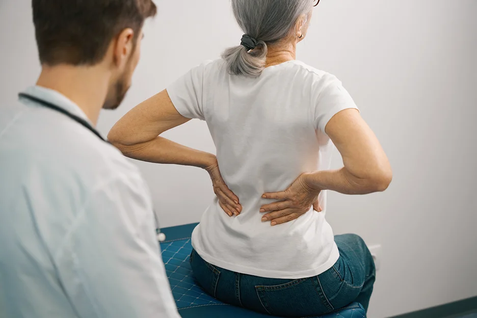 doctor and patient consultation on sciatica pain