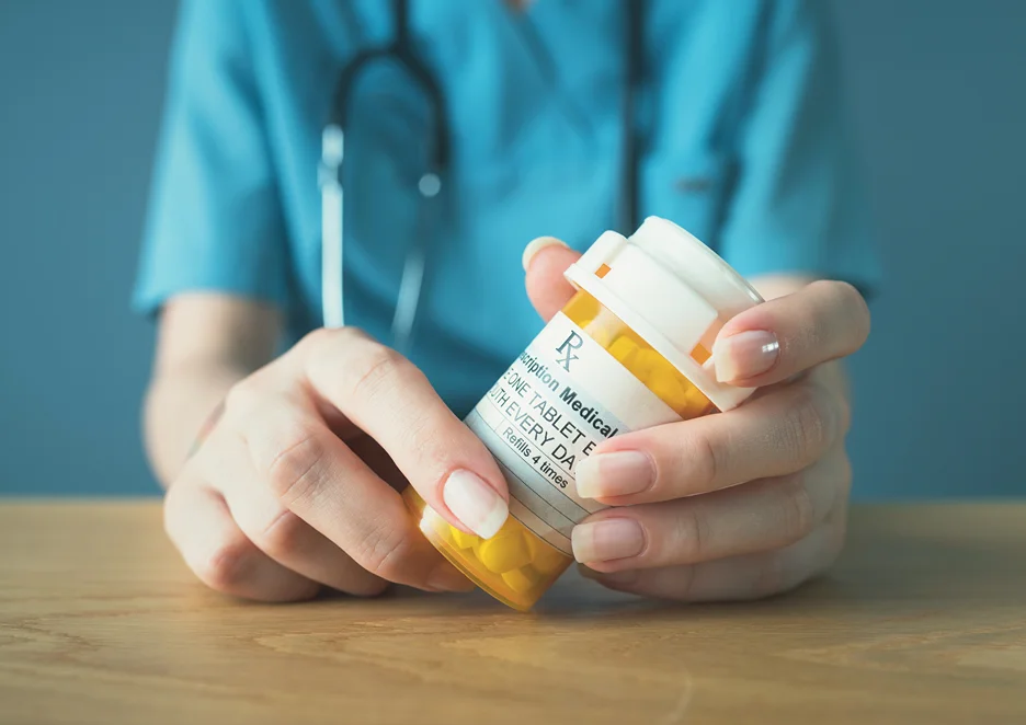 a doctor prescribes medication for back pain