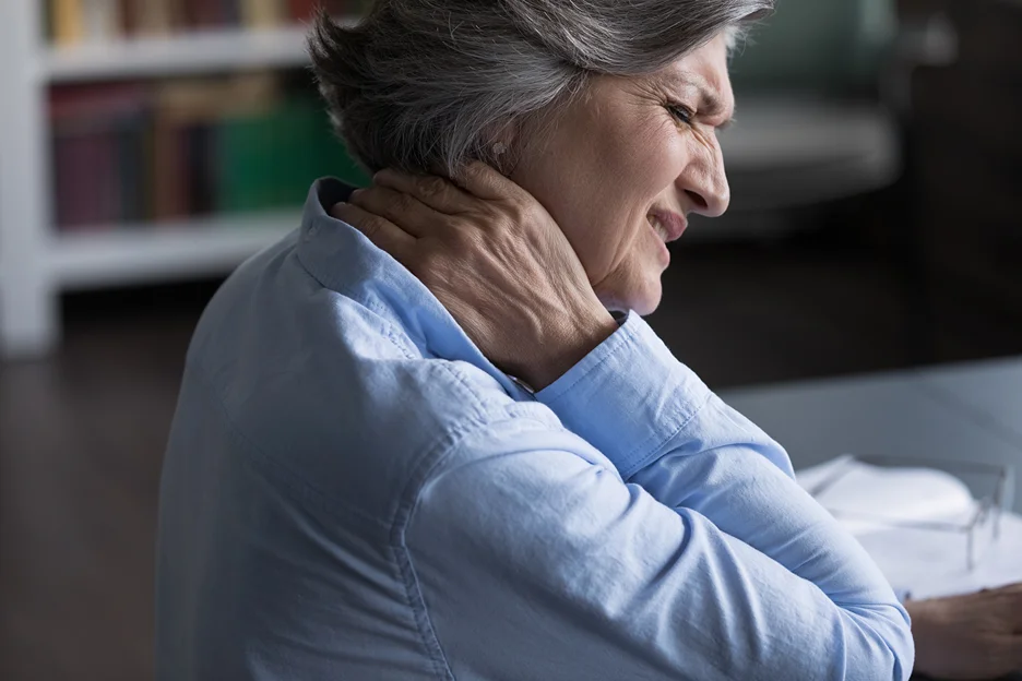 a matured woman suffers from ear and neck pain