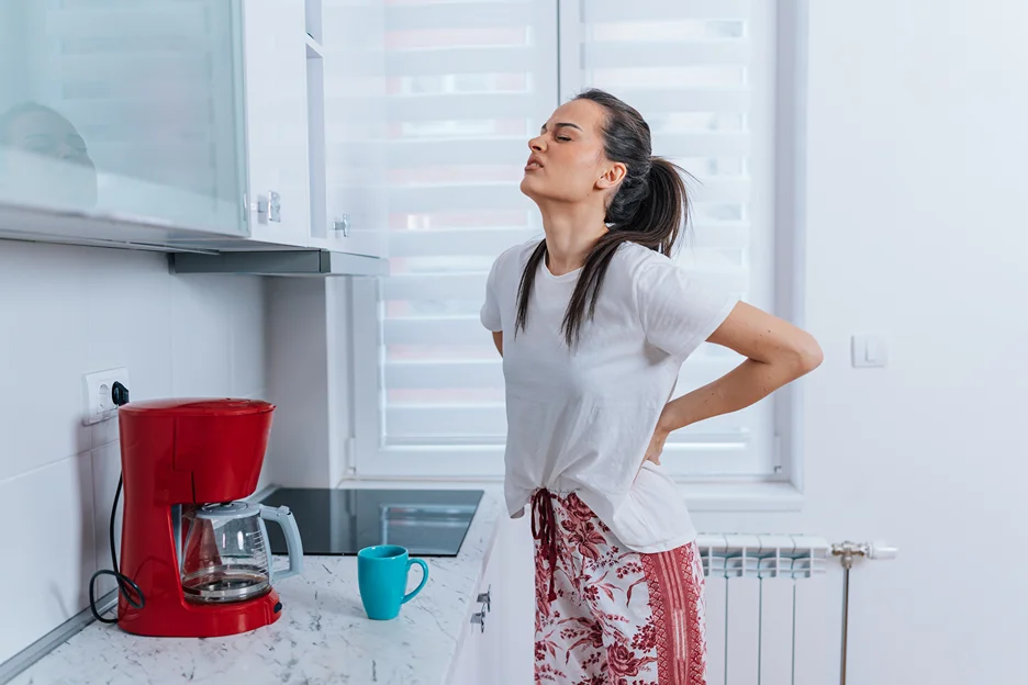 a woman suffering from back pain during period