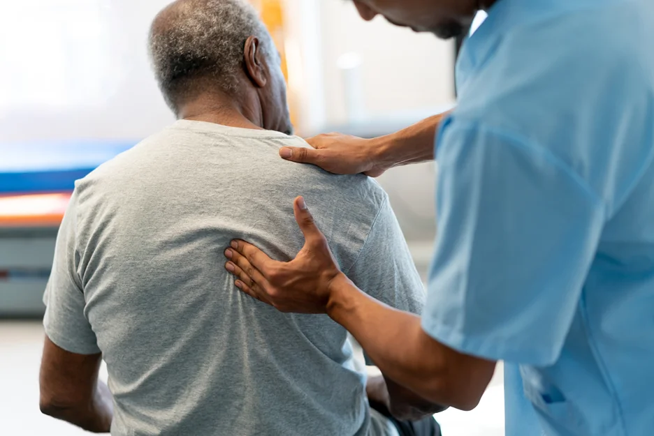doctor and patient consult on back pain due to cancer
