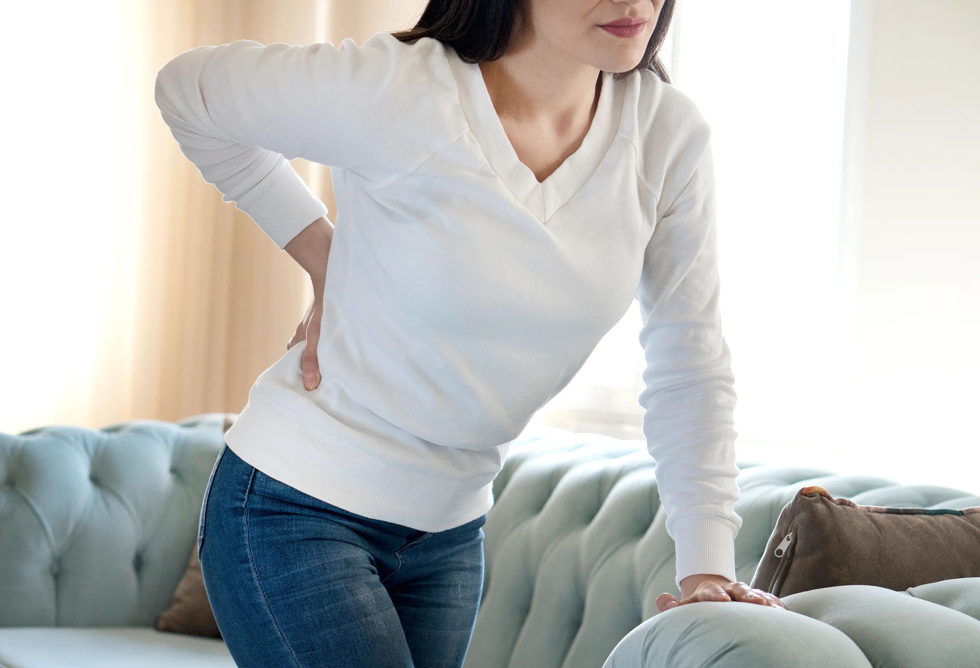 a woman suffering from low back pain