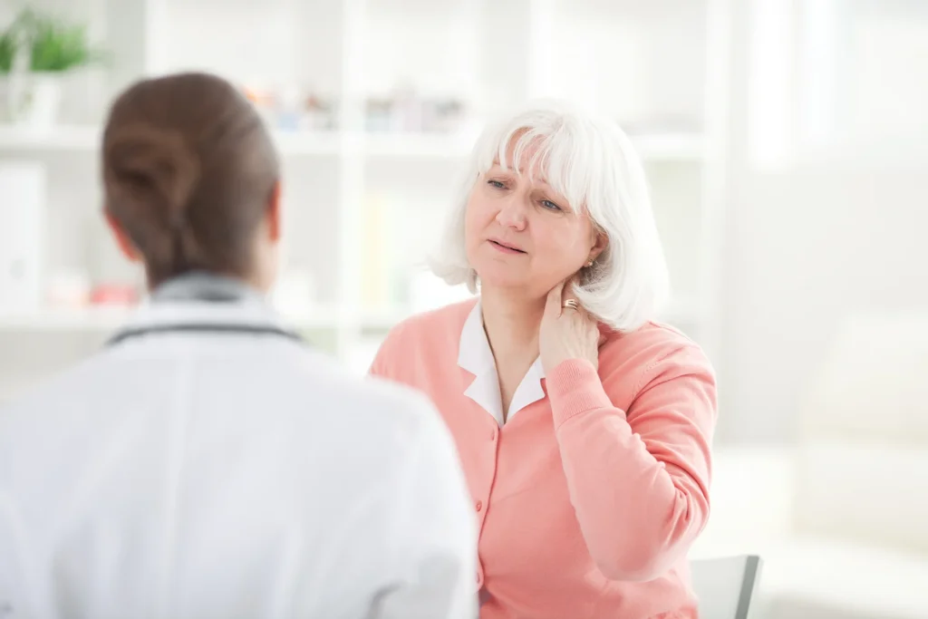 doctor and patient consult for neck pain and heart attact symptoms