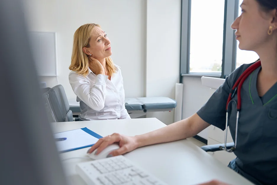 a woman undergoes neck pain consultation