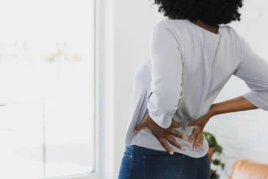 a woman suffering from sciatica pain