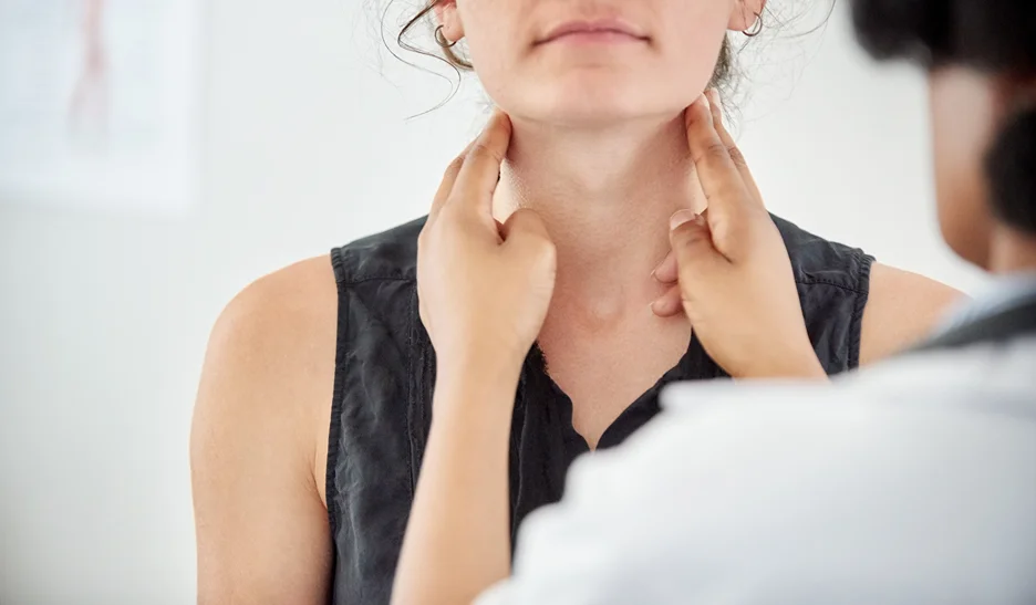 doctor and patient consult on thyroid neck pain