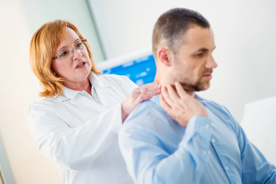 doctor and male patient consultation on neck pain