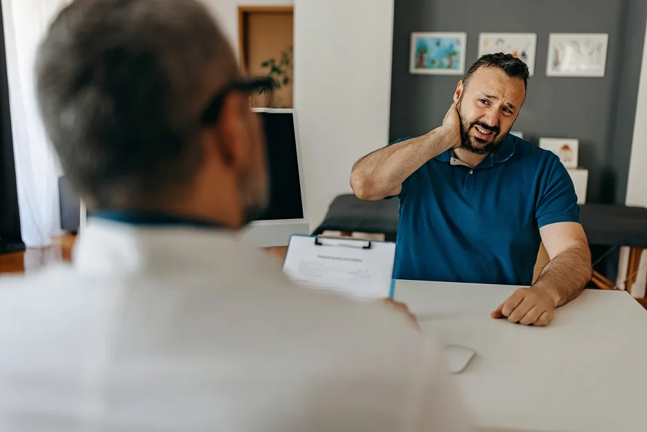 doctor and patient consult on neck pain