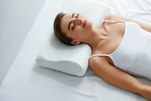 a woman is sleeping while using memory pillow for back pain